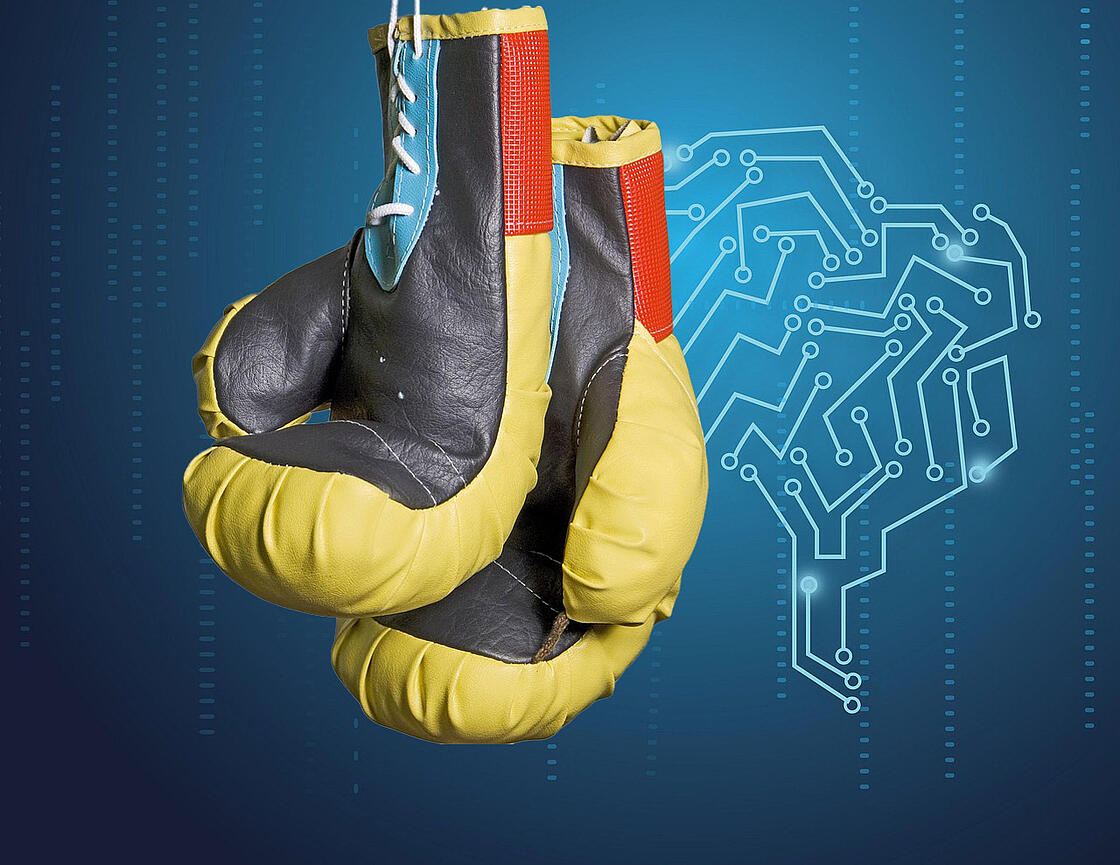 Zwei Boxhandschuhe vor einem Hintergrund mit digitalen Vernetzungen